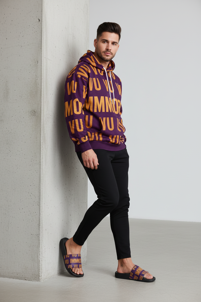 Male model wearing VU Immortal purple & gold hoodie and slides