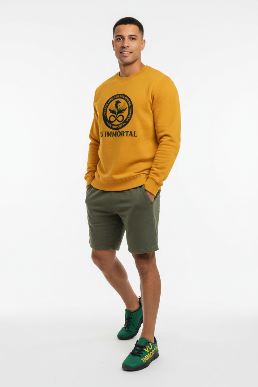 Model with VU Immortal gold crew neck and green sneakers full body